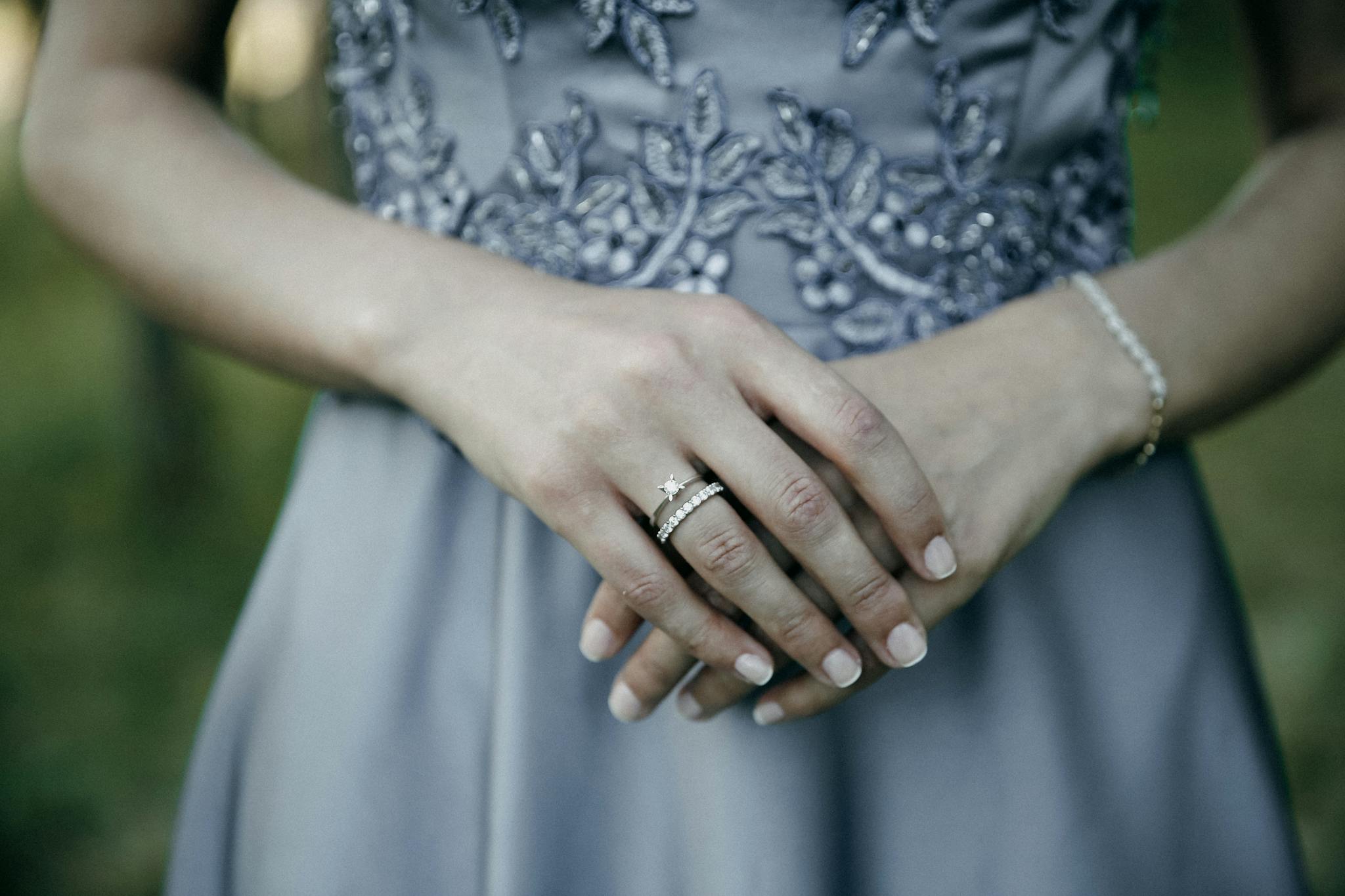 A detailed close-up of a bride's hands showcasing elegant jewelry, perfect for wedding themes.
